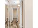 Hallway with wood-look floors and doors to other rooms at 10150 E Virginia Ave # 6-305, Denver, CO 80247