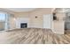 Living room with fireplace and kitchen access at 10150 E Virginia Ave # 6-305, Denver, CO 80247