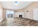 Living room with fireplace, sliding glass door, and hardwood floors at 10150 E Virginia Ave # 6-305, Denver, CO 80247