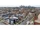 A high-angle shot captures the city skyline and neighborhood, offering a unique perspective at 3646 Quivas St, Denver, CO 80211