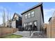 The backyard has a modern deck with railing, great space for outdoor living and entertaining at 3646 Quivas St, Denver, CO 80211