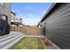 Well-maintained backyard with a privacy fence and access to additional structures at 3646 Quivas St, Denver, CO 80211