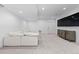 Inviting basement featuring soft carpet, ample seating, and media center at 3646 Quivas St, Denver, CO 80211