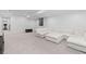 Spacious finished basement with plush carpeting and recessed lighting at 3646 Quivas St, Denver, CO 80211