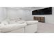 Cozy basement featuring carpeted floors, a comfortable sectional, and entertainment area at 3646 Quivas St, Denver, CO 80211