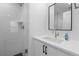 Modern bathroom with white tile shower, sleek vanity, and contemporary fixtures at 3646 Quivas St, Denver, CO 80211
