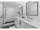 Contemporary bathroom features a double sink, a glass shower, and modern fixtures at 3646 Quivas St, Denver, CO 80211