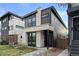 Contemporary home features mixed materials, dark accents, and professional landscaping at 3646 Quivas St, Denver, CO 80211