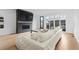 Relaxing living room with fireplace and modern sliding glass doors to access the rear patio at 3646 Quivas St, Denver, CO 80211