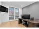 Bright office space featuring modern desk, large monitor, and multiple windows for great natural light at 3646 Quivas St, Denver, CO 80211