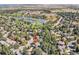 Beautiful aerial view of a home near a serene lake and lush green landscape at 3150 Lane Ct, Boulder, CO 80305