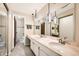 Bathroom with double sink vanity, stylish lighting, and access to the hall and the toilet at 3150 Lane Ct, Boulder, CO 80305