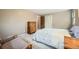 Bedroom with neutral walls, a comfortable floral-patterned comforter and closet at 3150 Lane Ct, Boulder, CO 80305