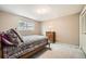 Comfortable bedroom featuring carpeting, a window, a full closet, and furnishings at 3150 Lane Ct, Boulder, CO 80305