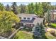 Charming two-story brick home with a lush green yard and mature trees, offering great curb appeal at 3150 Lane Ct, Boulder, CO 80305