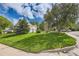 Beautiful two-story home with a lush green lawn, mature trees and a charming residential street at 3150 Lane Ct, Boulder, CO 80305