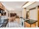 Spacious eat-in kitchen with dark counters, white tile floors, and wood cabinets at 3150 Lane Ct, Boulder, CO 80305