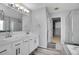 Bathroom featuring a double sink vanity and a walk-in shower at 6348 Westview Cir, Parker, CO 80134