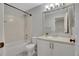 Bathroom featuring a tub and shower, toilet, and sink with a vanity and large mirror at 6348 Westview Cir, Parker, CO 80134