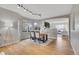 Elegant dining area with a modern table and chairs, and a view into the living room at 6348 Westview Cir, Parker, CO 80134