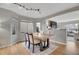 Dining room with a large table, modern lighting, and an open layout, perfect for entertaining at 6348 Westview Cir, Parker, CO 80134