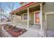 Inviting front porch featuring a cozy seating area and meticulously maintained landscaping at 6348 Westview Cir, Parker, CO 80134