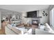 Bright and airy living room featuring a fireplace and hardwood floors at 6348 Westview Cir, Parker, CO 80134