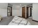 Comfortable bedroom featuring neutral tones, multiple doorways, and soft carpet flooring at 30221 Marge Ln, Evergreen, CO 80439