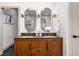 Bathroom featuring a glass shower, double sink, and modern hardware at 900 S Webster St, Lakewood, CO 80226