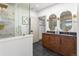 Bathroom featuring a glass shower, double sink, and modern hardware at 900 S Webster St, Lakewood, CO 80226