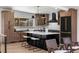 Gourmet kitchen with stainless steel appliances, large island, and breakfast bar at 900 S Webster St, Lakewood, CO 80226