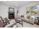 Cozy living room features a fireplace and a window view of the outdoors at 900 S Webster St, Lakewood, CO 80226