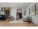 Bright living room showcases a modern fireplace and view into the kitchen at 900 S Webster St, Lakewood, CO 80226