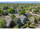 Aerial view of the home and neighborhood, highlighting the surrounding greenery and quiet residential area at 11760 Eudora Ct, Thornton, CO 80233