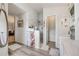 Chic bathroom showcasing a walk-in shower, dual vanities, and modern farmhouse decor at 11760 Eudora Ct, Thornton, CO 80233