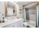 Modern bathroom featuring ship lap walls, a marble vanity, and a tiled shower at 11760 Eudora Ct, Thornton, CO 80233