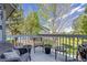 Charming outdoor deck featuring wicker furniture and a beautiful backyard view at 11760 Eudora Ct, Thornton, CO 80233
