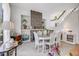 Elegant dining room featuring a stone fireplace, shelving, and stairway at 11760 Eudora Ct, Thornton, CO 80233