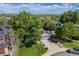 Beautiful front yard with mature trees, lush lawn, and a well-maintained home exterior, showcasing curb appeal at 11760 Eudora Ct, Thornton, CO 80233