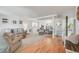 Spacious living room featuring hardwood floors, neutral-toned furniture, and ample natural light at 11760 Eudora Ct, Thornton, CO 80233