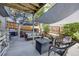 Relaxing patio area featuring comfortable seating, a pergola, and a hot tub at 11760 Eudora Ct, Thornton, CO 80233