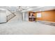 Spacious basement with a wet bar and staircase at 2028 Ulster St, Denver, CO 80238