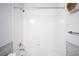 Simple bathroom with shower/tub combo and tile at 2028 Ulster St, Denver, CO 80238