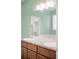 Double vanity bathroom with a large mirror and modern fixtures at 2028 Ulster St, Denver, CO 80238