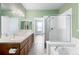 Elegant bathroom with double vanity and a shower/tub combo at 2028 Ulster St, Denver, CO 80238