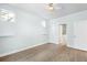 Bright bedroom with wood-look floors and ceiling fan at 2028 Ulster St, Denver, CO 80238