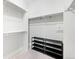 Walk-in closet with shelving and rods for storage, offering an organized space for clothes and shoes at 2028 Ulster St, Denver, CO 80238