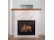 Modern corner fireplace with marble surround and gas logs at 2028 Ulster St, Denver, CO 80238