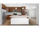 Modern kitchen with stainless steel appliances and an island at 2028 Ulster St, Denver, CO 80238