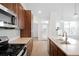 Modern kitchen with stainless steel appliances and an island at 2028 Ulster St, Denver, CO 80238